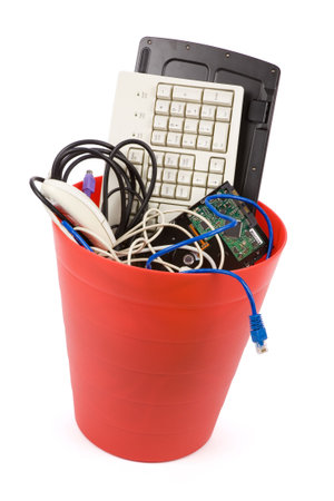 Red Garbage Can and  Discarded Computer Hardware