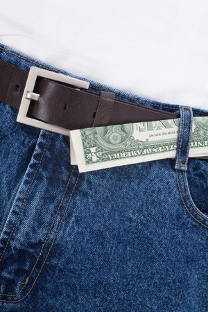a blue jean and dollars close up shotの写真素材