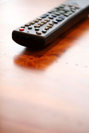 Remote Control and coffee table close up shotの写真素材