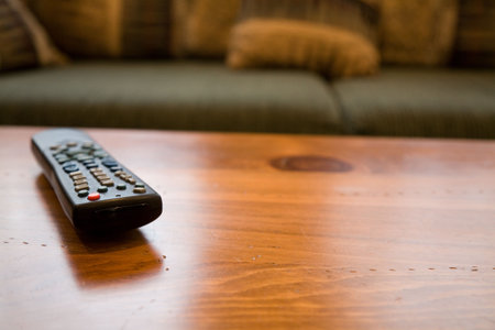 Remote Control and coffee table close up shot
