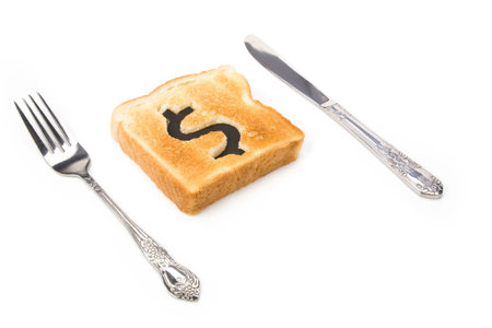 bread slice with dollar sign, concept high price of food or food for businessの写真素材