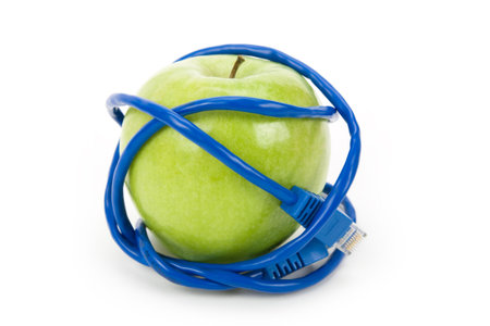 Green apple and Network cable, Danger of internetの写真素材
