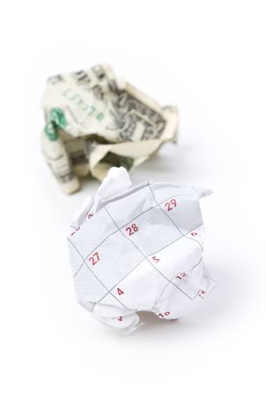 Calendar paper ball and dollar, concept of Wasting Time and moneyの写真素材