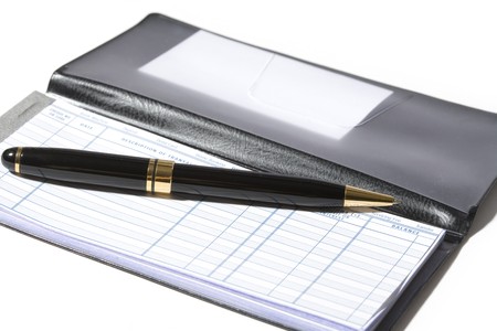 Checkbook and pen with white backgroundの写真素材