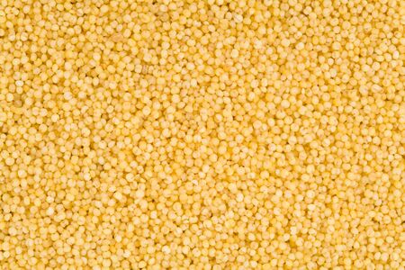 yellow millet seeds for backgroundの写真素材