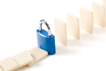 Domino and Lock, Concept of business damage control  の写真素材
