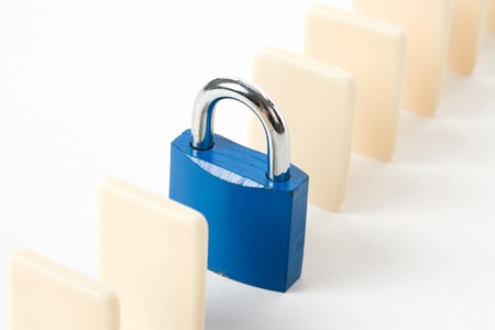Domino and Lock, Concept of business damage control  の写真素材