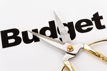 text of Budget and scissors, concept of Budget cutの写真素材
