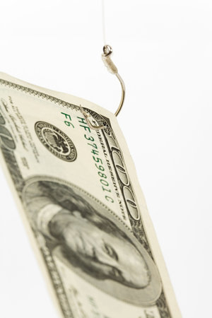 Fishing Hook and Dollar Close up Shot