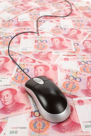 Chinese money and Computer Mouse, Business Conceptの写真素材