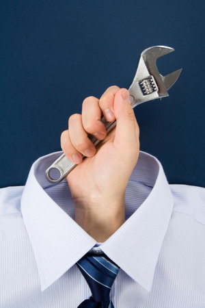 hand holding Wrench, Business Conceptの写真素材