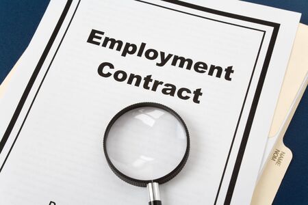 Employment Contract and magnifier, business conceptの写真素材