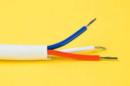 Electrical wire with yellow background