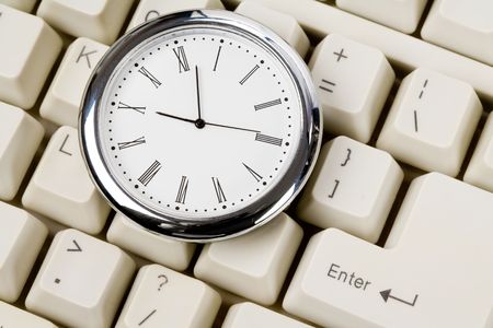 Clock and computer Keyboard close upの写真素材