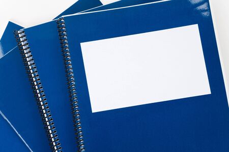 Blue school textbook, notebook or manual with white backgroundの写真素材