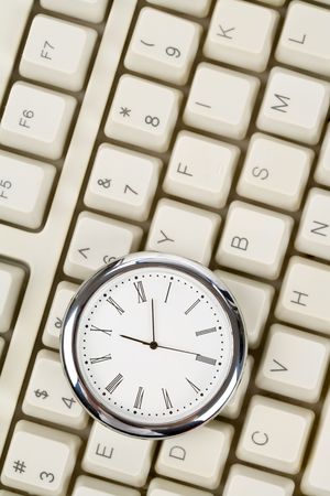 Clock and computer Keyboard close upの写真素材