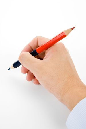 hand holding a red and blue pencil with white backgroundの写真素材