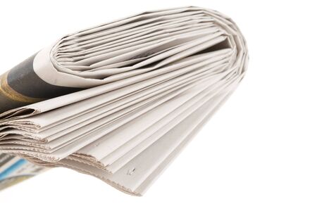 Folded Newspaper with white backgroundの写真素材