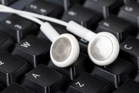 Headphones and black keyboard, concept of digital musicの写真素材