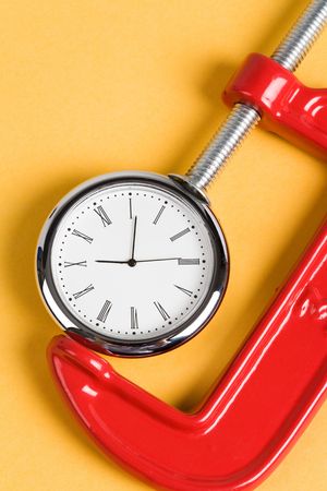 Vise Grip and Clock, Concept of busyの写真素材