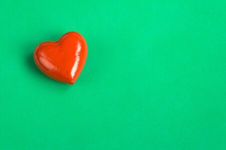 Red Heart on green paper, love messageの写真素材