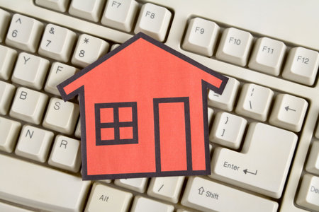 a red home sign and computer keyboard,  Real Estate Concept 
