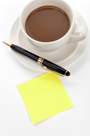 Coffee cup and note pad close upの写真素材
