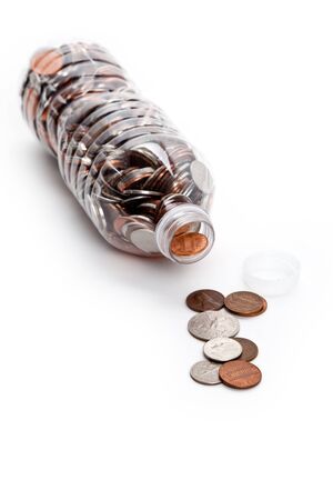 Plastic Bottle and Coins,Dollar with white backgroundの写真素材