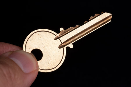 Golden House Key with black background