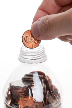 Plastic Bottle and Coins,Dollar with white background