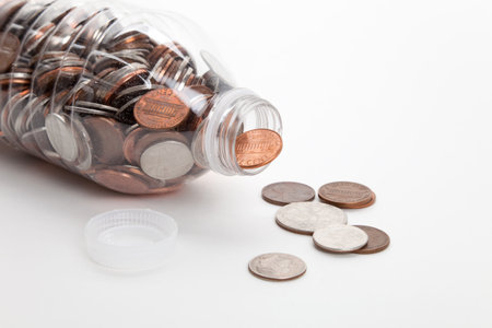 Plastic Bottle and Coins,Dollar with white background