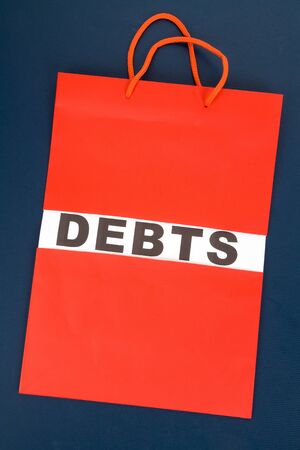 Shopping Bag and word debts concept of Financial difficultyの写真素材