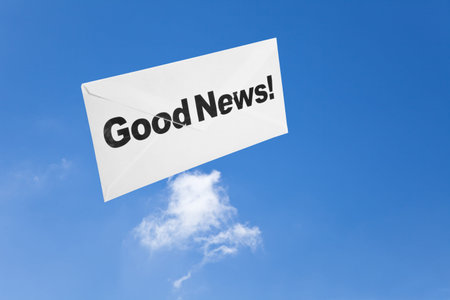 Good News,envelope and blue sky, concept of successの写真素材