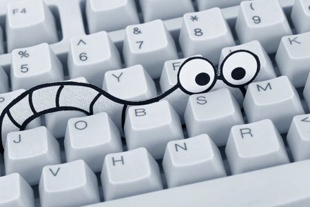 Worm and computer keyboard, concept of Security, Virus