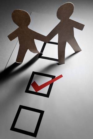 checkbox and Paper Chain Men close upの写真素材