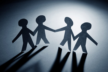Paper Chain Men, concept of Teamwork