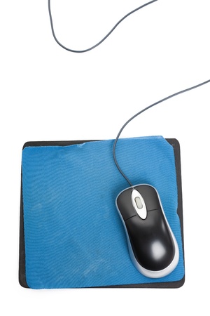 Computer Mouse and old Mouse pad close upの写真素材