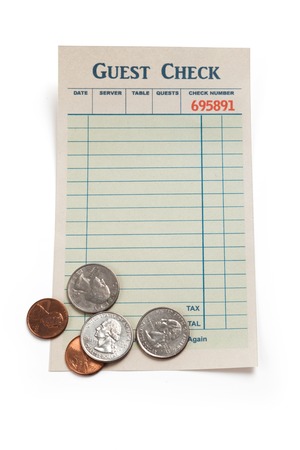 Blank Guest Check and Coin, concept of restaurant tip.の写真素材
