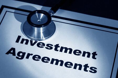 stethoscope and investment Agreement, concept of contract issueの写真素材