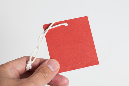 hand hold a red tagの写真素材