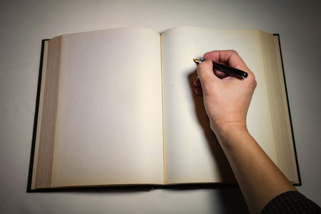 Blank white pages in an open hardcover book.