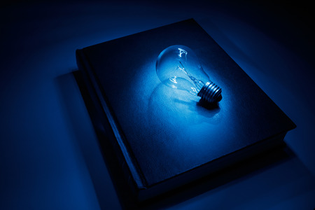 book and light bulb, business education concept.の写真素材