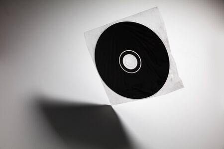 a CD , DVD disk with dark shadow ,  technology concept.の写真素材