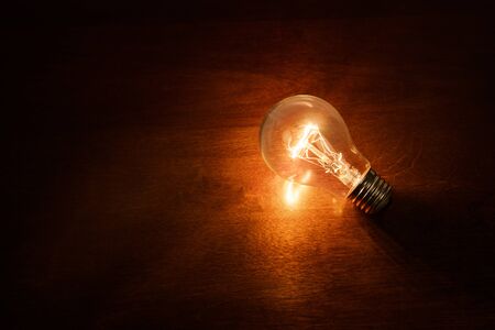 light bulb on dark background, concept of creativity.の写真素材