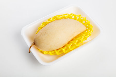 fresh yellow mango with white background, close up.の写真素材