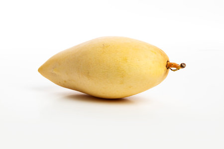 fresh yellow mango with white background, close up.