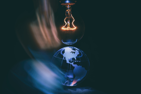 Light bulb and earth, concept of global issuesの写真素材
