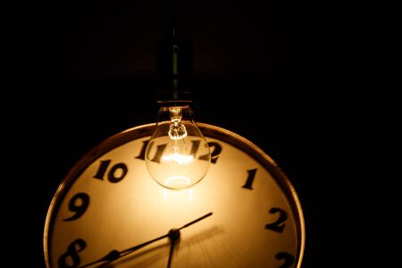 Light bulb and clock, concept of idea.の写真素材