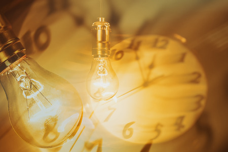 Light bulb and clock, concept of idea.の写真素材