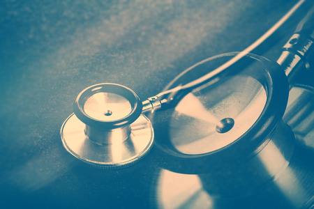 stethoscope with dark background, concept of healthcareの写真素材